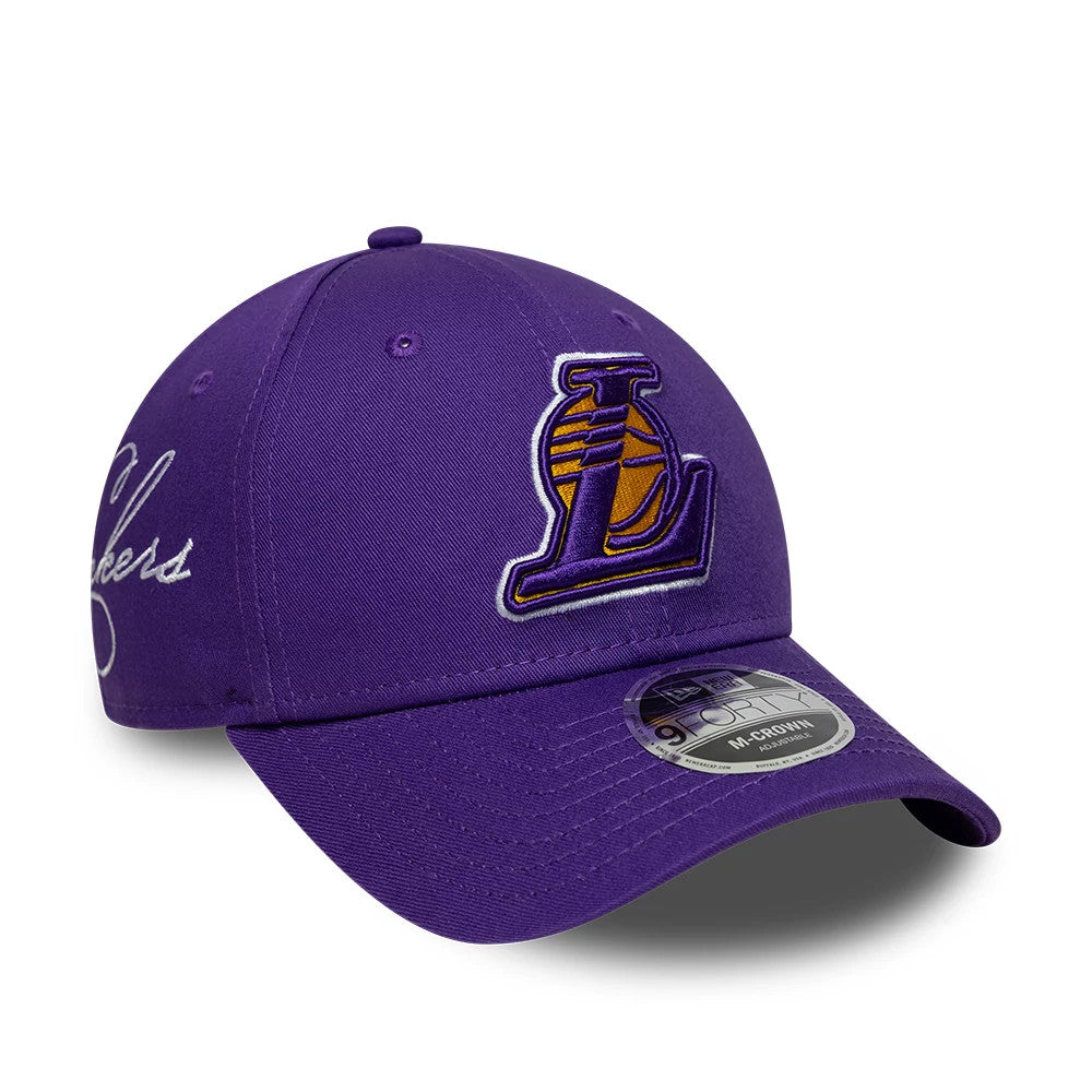 LA Lakers NBA Side Script Purple New Era 9FORTY M-Crown Adjustable Cap, three-quarter view showing the raised purple and yellow Lakers logo on the front panel, white script embroidery on the side, and a 9FORTY size sticker on the curved purple visor.