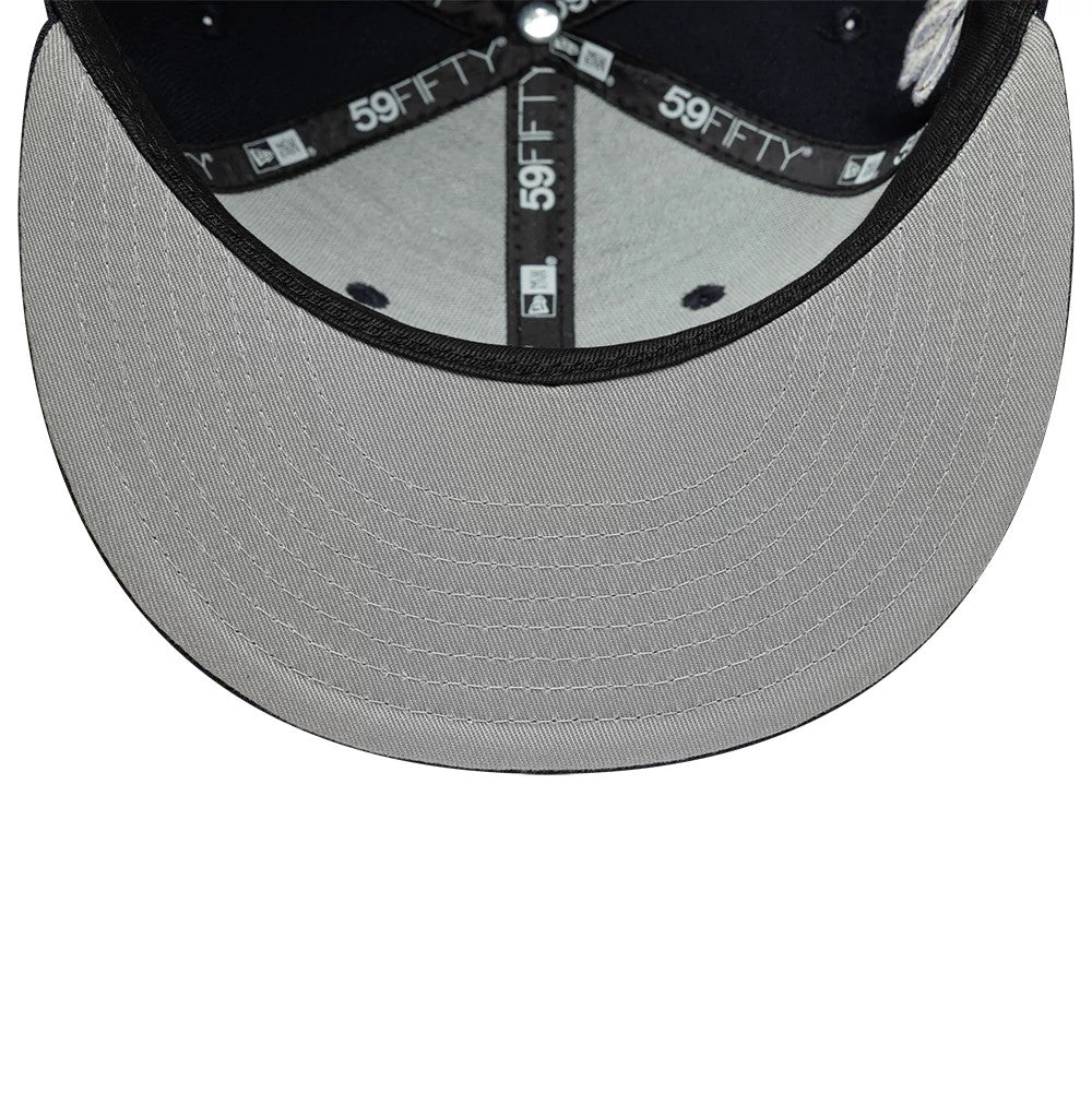 New Era Heritage Script Navy 59FIFTY Fitted Cap, inside view showing the grey undervisor with stitching lines, black sweatband, and branded 59FIFTY taping along the seams of the structured navy crown.