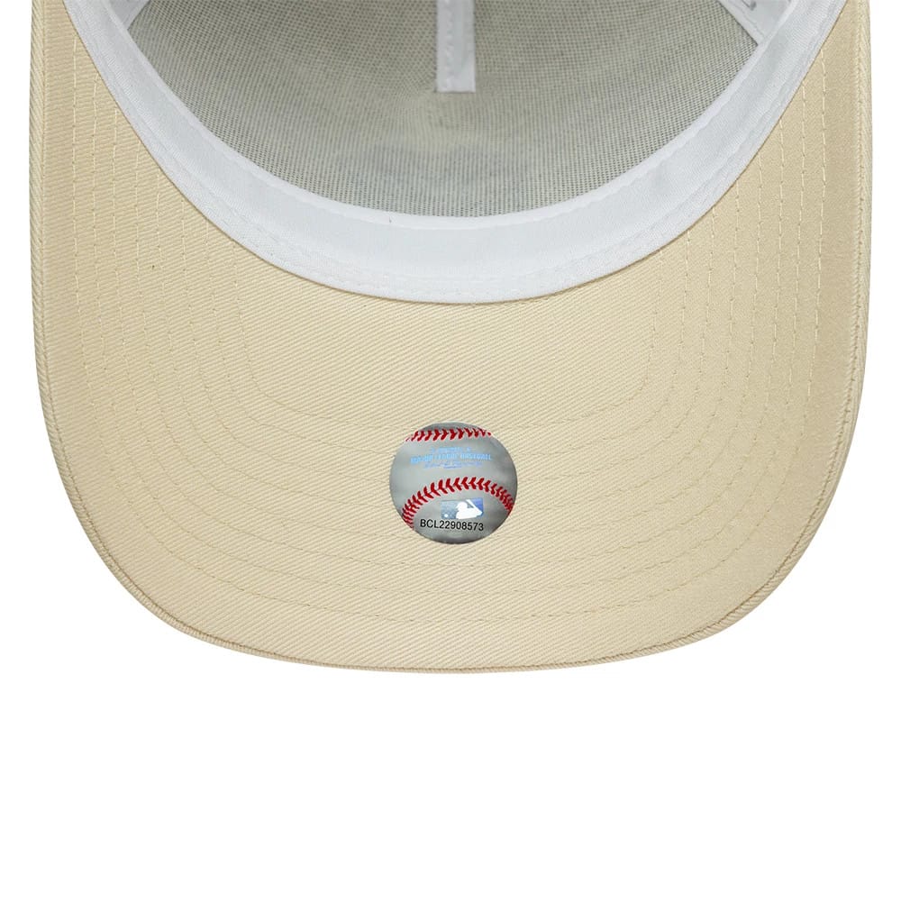Pictured is this MLB Outline New York Yankees 9FORTY E-Frame Trucker cap in cream. 5