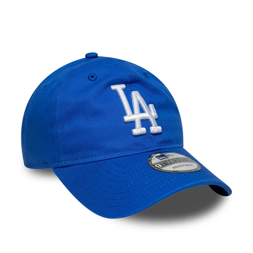 LA Dodgers MLB League Essential Bright Blue New Era 9TWENTY Adjustable Cap, front view showing the white raised embroidered LA logo on the front panel, with a curved visor and a 9TWENTY size sticker on the bright blue fabric.