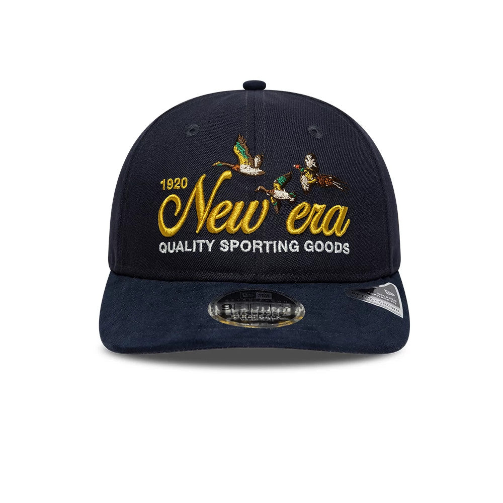 New Era Suede Navy Retro Crown 9FIFTY Adjustable Cap, front view showing gold embroidered New Era lettering and flying ducks, with 1920 and Quality Sporting Goods text on the structured navy crown, and a black 9FIFTY size sticker on the visor.