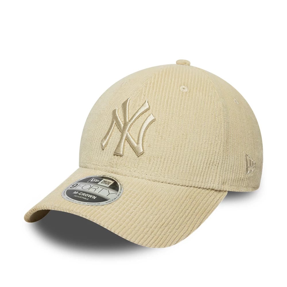New York Yankees MLB Cord Cream New Era 9FORTY M-Crown Adjustable Cap, three-quarter view showing the raised embroidered NY logo in cream on the front panel, with a matching corduroy visor, and a 9FORTY size sticker on the visor.