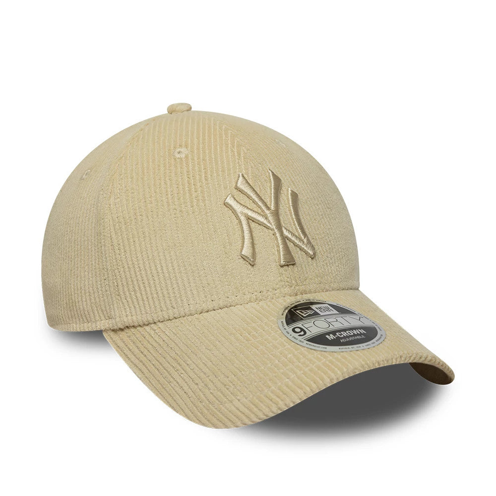 New York Yankees MLB Cord Cream New Era 9FORTY M-Crown Adjustable Cap, three-quarter view showing the raised NY logo embroidered on the front panels, set on a structured cream corduroy crown with a curved visor and a 9FORTY size sticker.