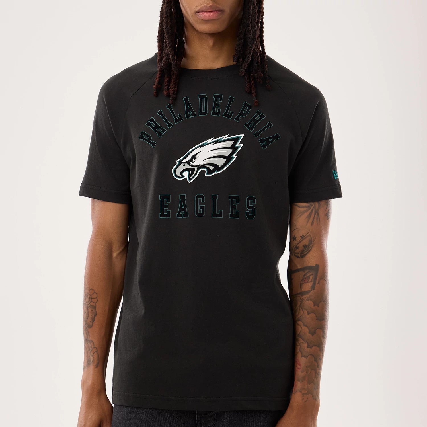 The model is wearing this NFL Sideline 2026 Philadelphia Eagles T-Shirt in black. 4