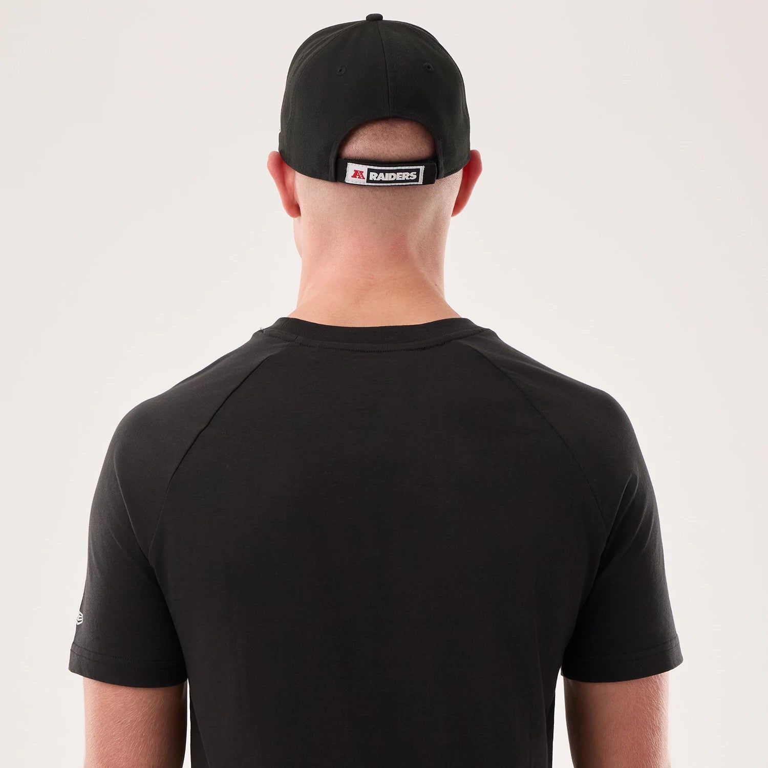 The model is wearing this NFL Sideline 2026 Las Vegas Raiders T-Shirt in black. 4