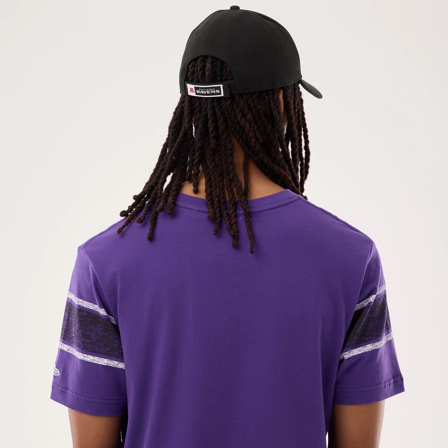 The model is wearing this NFL Sideline 2026 Baltimore Ravens T-Shirt in purple. 7