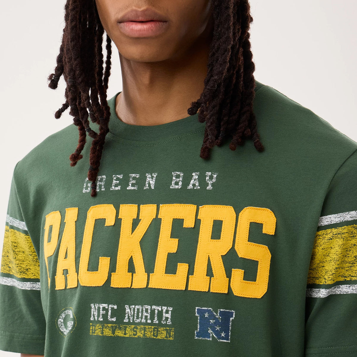 The model is wearing this NFL Sideline 2026 Green Bay Packers T-Shirt in dark green. 3