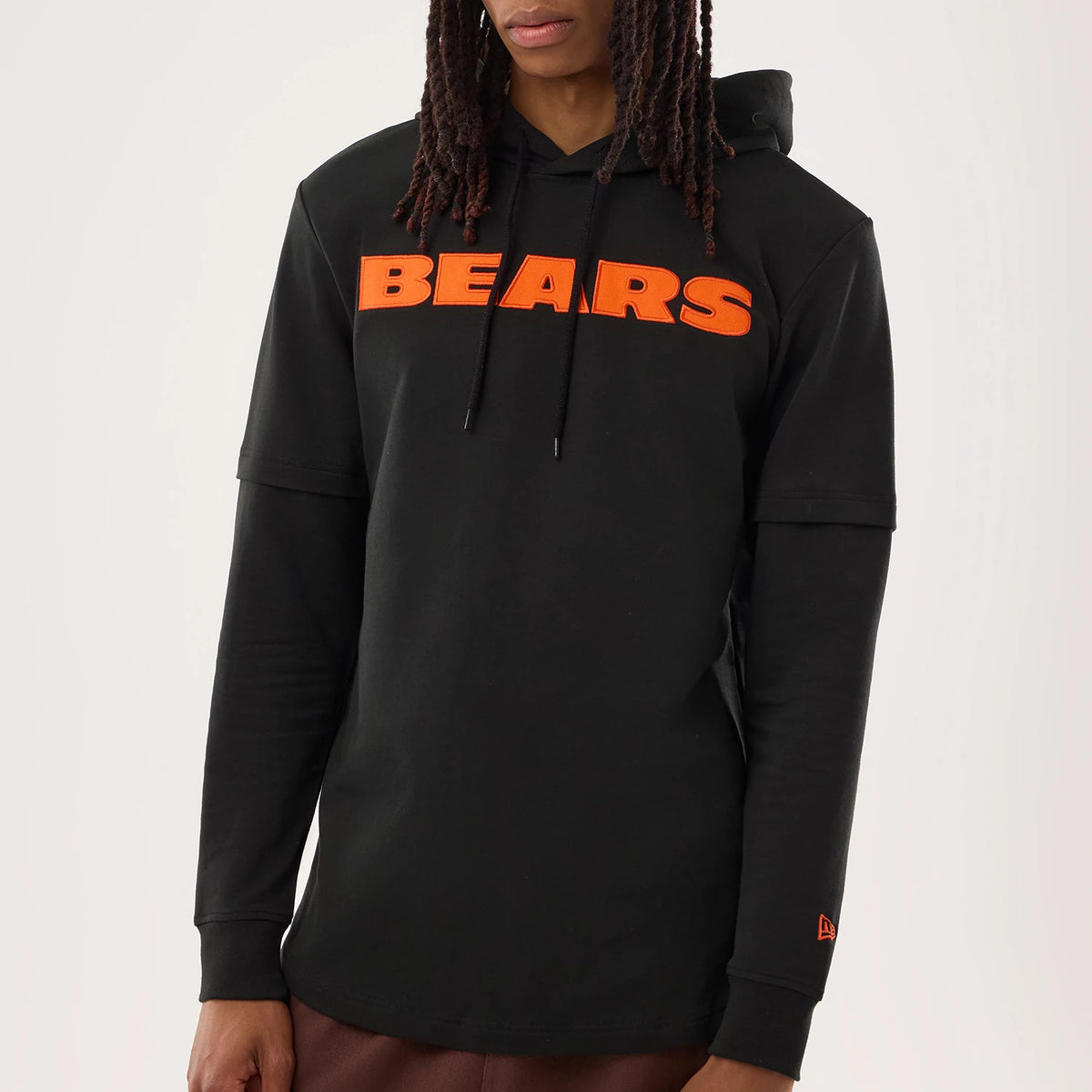 The model is wearing this NFL Sideline 2026 Chicago Bears Double Sleeve Hoodie in black. 3