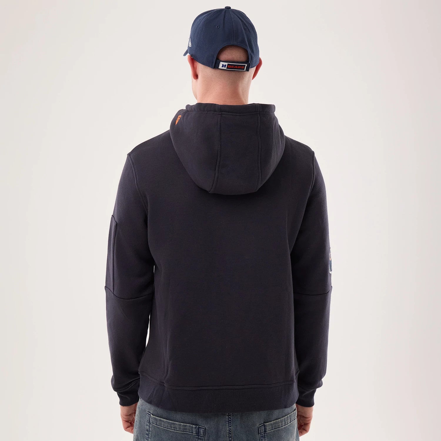 The model is wearing this NFL Sideline 2026 Chicago Bears Pullover Hoodie in navy. 2