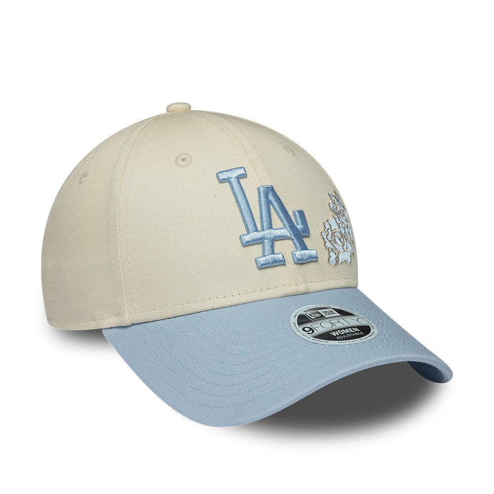 LA Dodgers Womens MLB Floral Cream New Era 9FORTY Adjustable Cap, three-quarter view showing a light blue embroidered LA logo on the front panel, matching floral embroidery to the side, and a light blue curved visor with a 9FORTY size sticker.