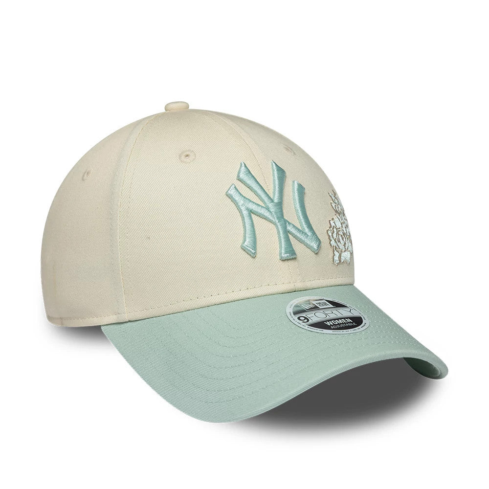 New York Yankees Womens MLB Floral Cream New Era 9FORTY Adjustable Cap, three-quarter view showing the raised mint green embroidered NY logo on the front panel, a mint floral design to its right.
