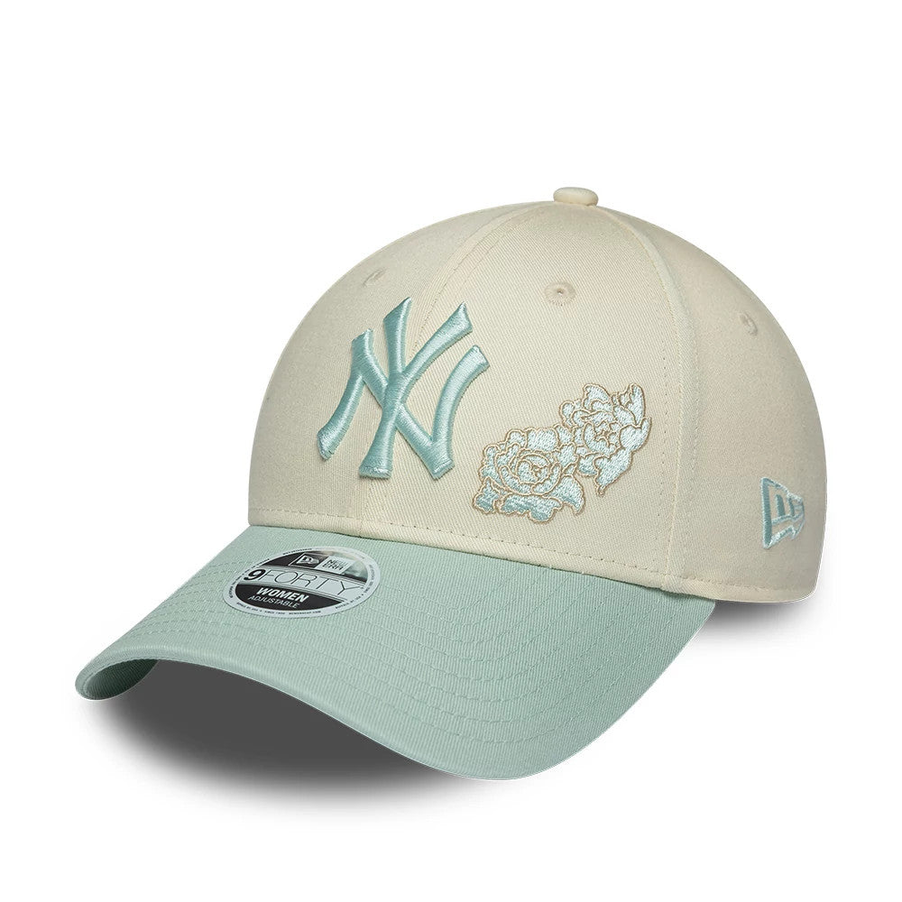 New York Yankees Womens MLB Floral Cream New Era 9FORTY Adjustable Cap, front view showing the raised MLB NY logo in teal embroidery beside floral on the cream front panel, with a curved teal visor and 9FORTY size sticker.
