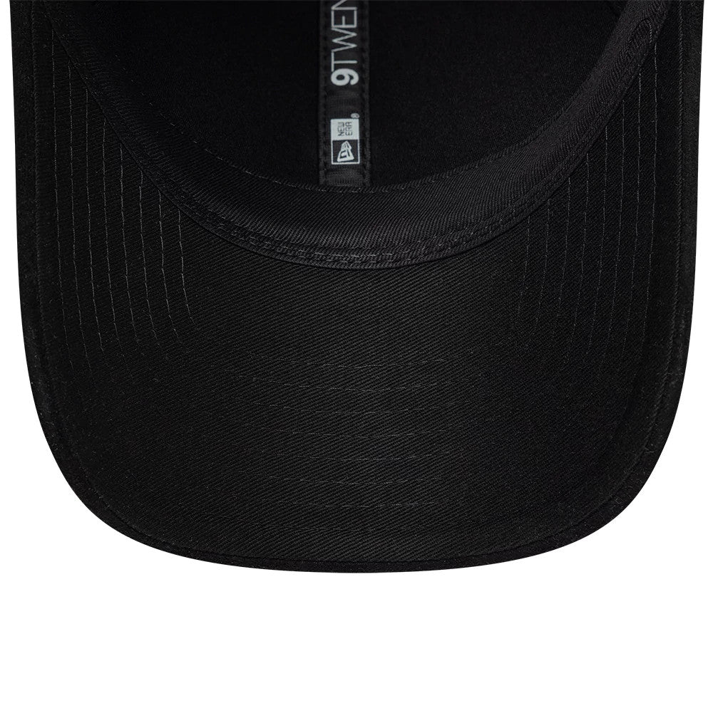 New Era Textured Black 9TWENTY Adjustable Cap, inside view showing black undervisor with stitching, black taping with white 9TWENTY lettering, and the interior seam finishing of the curved visor edge.
