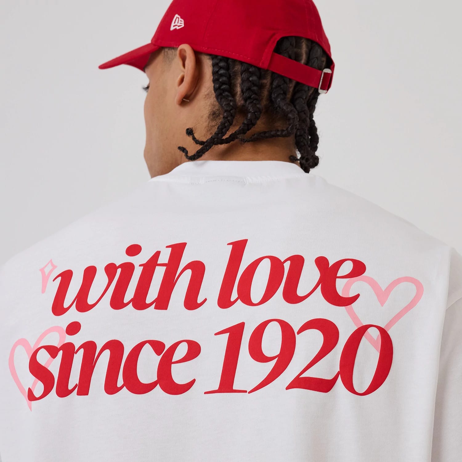 The model is wearing this New Era Love Graphic T-Shirt in white. 3