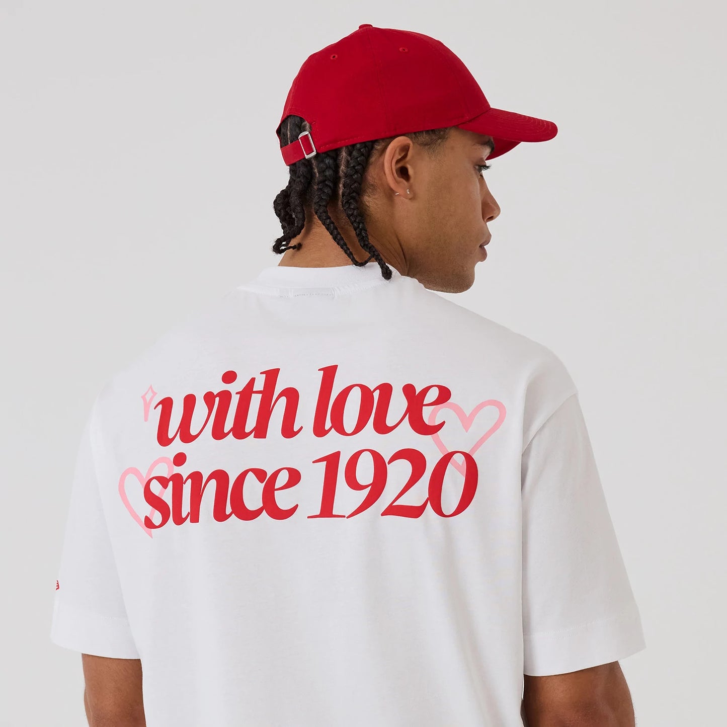 The model is wearing this New Era Love Graphic T-Shirt in white. 6