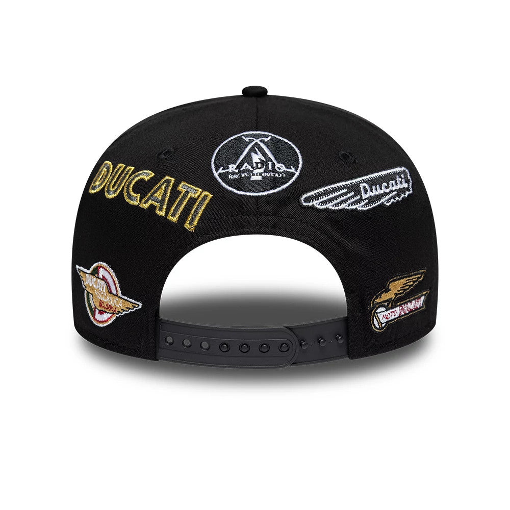 Ducati Motor Logo Patch Black New Era 9SEVENTY Stretch Snap Adjustable Cap, rear view showing multiple embroidered patches including a large gold Ducati logo and other logo designs in white and gold on the black adjustable snapback closure.