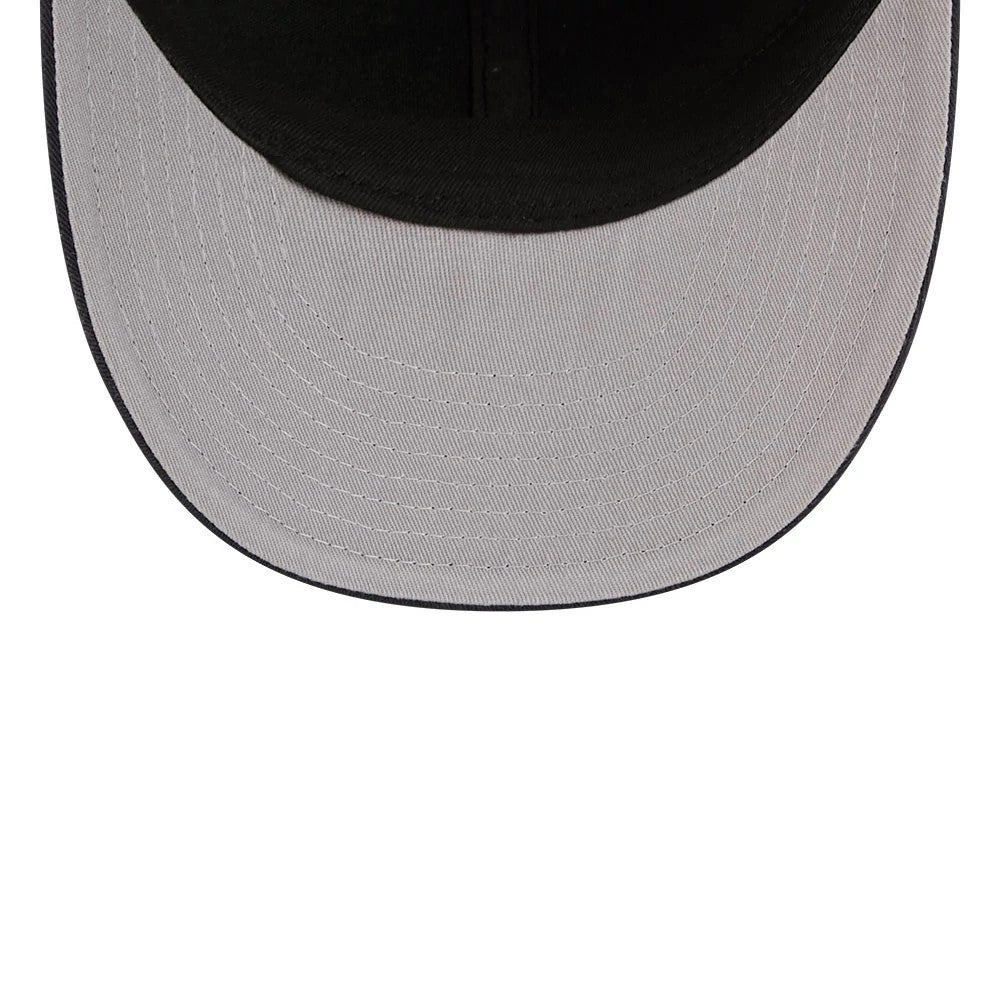 New York Yankees MLB American Herringbone Green New Era 59FIFTY Fitted Cap, inside view showing a grey undervisor with stitching details, beneath a flat black visor, showcasing the cap's structure and craftsmanship.