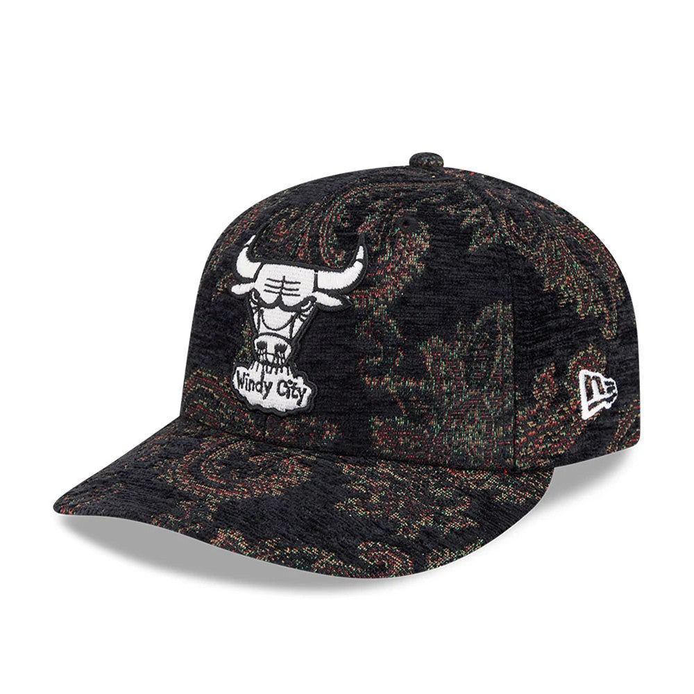 Chicago Bulls NBA Jacquard Chenille Black New Era 59FIFTY Fitted Cap, three-quarter view showing the white raised embroidered Bulls logo on the front panel, intricate jacquard pattern across the black crown and visor.
