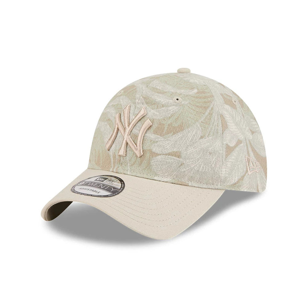 New York Yankees MLB Leafy Palm Light Beige New Era 9TWENTY Adjustable Cap, three-quarter view showing raised beige NY logo embroidered on the front panel, light beige visor with matching top button, and New Era flag logo on the left side.