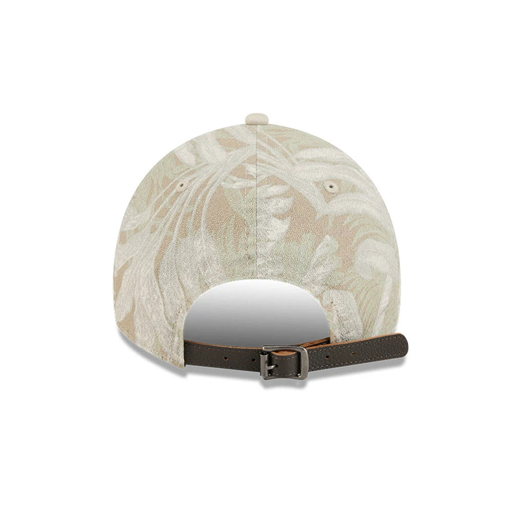 New York Yankees MLB Leafy Palm Light Beige New Era 9TWENTY Adjustable Cap, rear view showing the brown adjustable strap with a buckle, light beige leafy palm pattern across the unstructured crown, and embroidered eyelets.