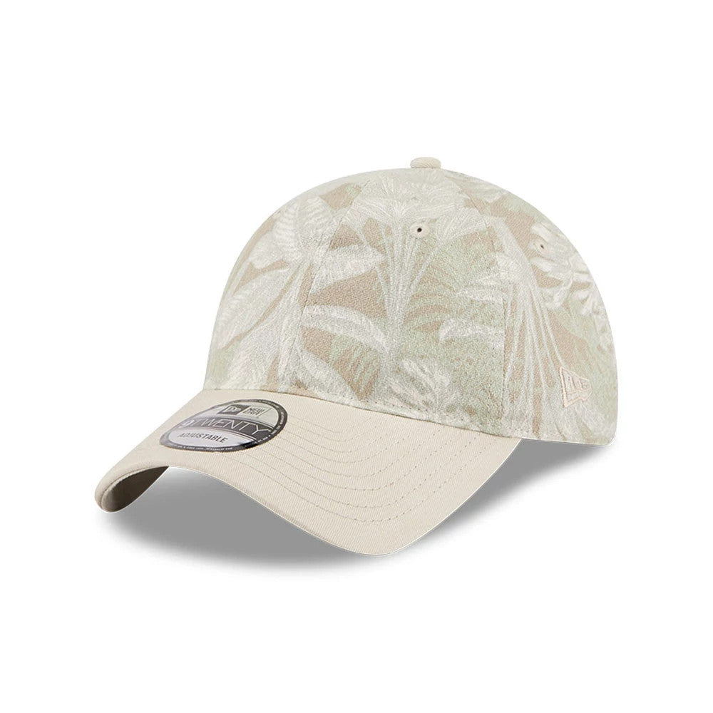 New Era Leafy Palm Light Beige New Era 9TWENTY Adjustable Cap, three-quarter view with a palm leaf pattern on the structured crown, light beige curved visor, and the New Era flag logo on the left side, featuring a 9TWENTY size sticker on the visor.