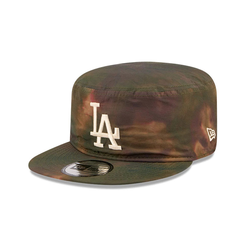 New Era LA Dodgers MLB Nylon Wash Dye Open Green Painter Cap, three-quarter view showing the white LA embroidered logo on the front panel, a green to brown wash-dye effect on the crown and visor, and the New Era flag logo on the left side.