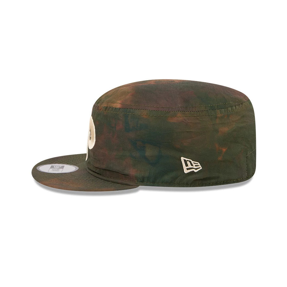 New Era Philadelphia Phillies MLB Nylon Wash Dye Open Green Painter Cap, side view showing the embroidered New Era flag logo on the left side of the dyed green crown, a flat visor with a 9FORTY size sticker, and a raised circular front logo.