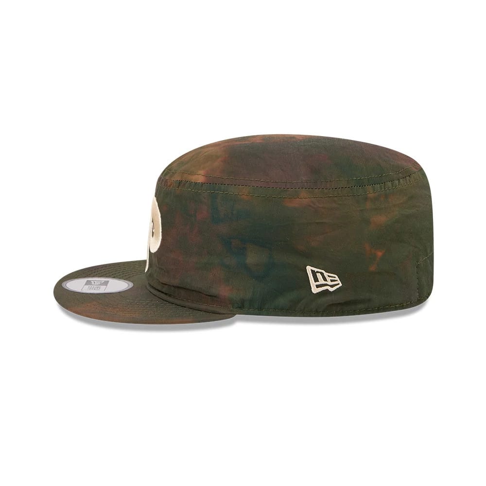 New Era Philadelphia Phillies MLB Nylon Wash Dye Open Green Painter Cap, side view showing the embroidered New Era flag logo on the left side of the dyed green crown, a flat visor with a 9FORTY size sticker, and a raised circular front logo.