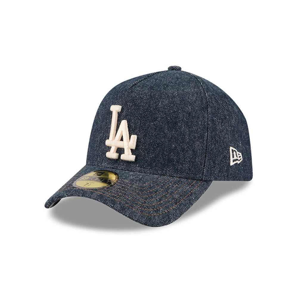 Dodgers MLB Herringbone Denim Navy New Era 59FORTY A-Frame Fitted Cap, three-quarter view showing the cream embroidered LA logo on the structured denim crown, a curved visor with orange stitching and a gold 59FORTY size sticker.