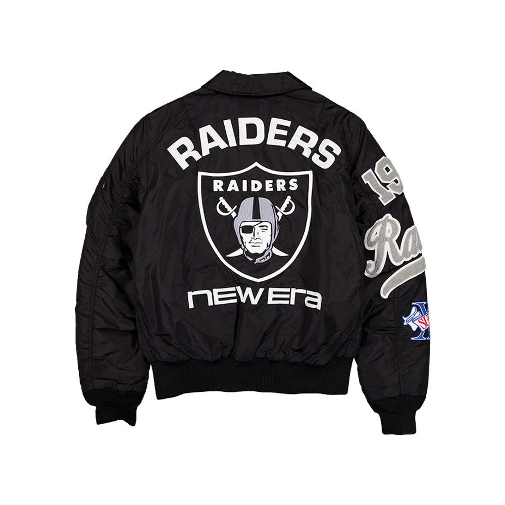 New Era Las Vegas Raiders NFL X Alpha Black Jacket, back view displaying a large embroidered Raiders shield logo in the centre, white Raiders lettering above, New Era branding below, and additional detailed patches on the sleeves.