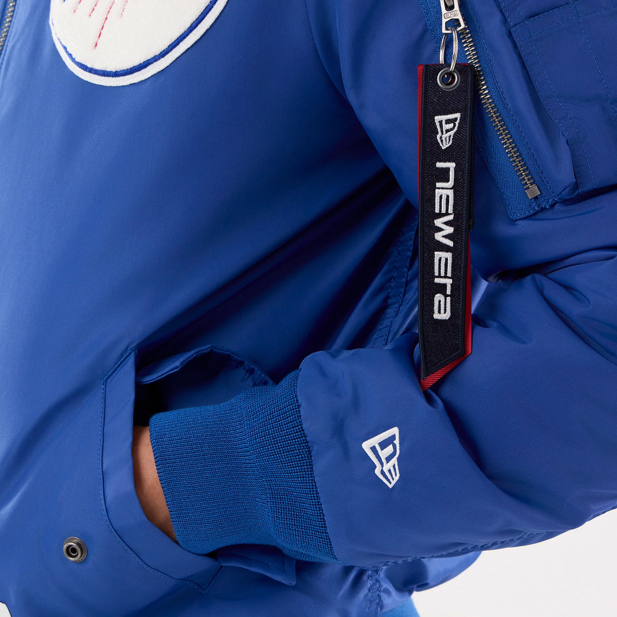 The model is wearing this MLB X Alpha LA Dodgers Jacket in Blue. 4