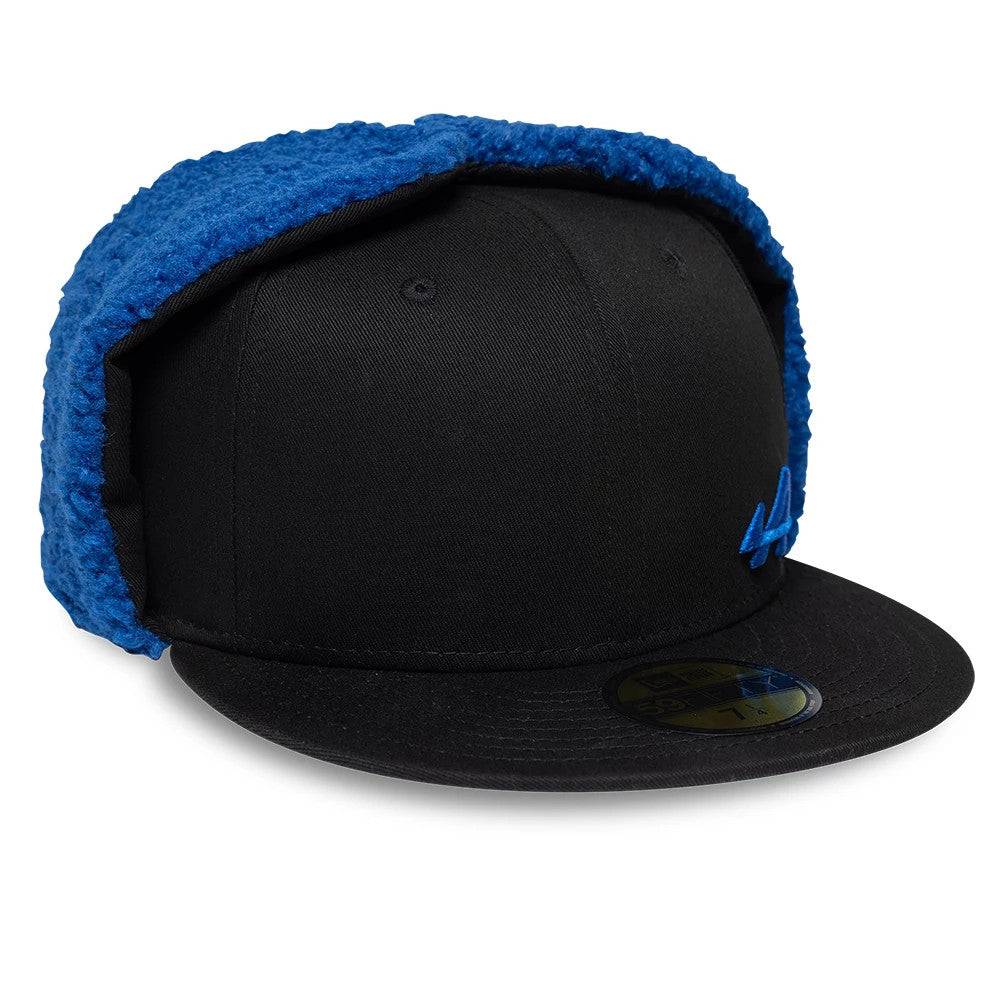Alpine Racing A390 Navy Dogear New Era 59FIFTY Fitted Cap, three-quarter view showing the blue embroidered A logo on the front panel, black flat visor with a gold 59FIFTY size sticker, and folded blue dogear flaps on the sides.