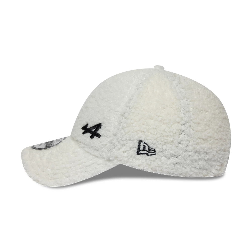 Alpine Racing A390 Cream New Era 9FORTY Adjustable Cap, side view showing the black embroidered number 4 and New Era flag logo on the fluffy cream crown, with a curved visor featuring a 9FORTY size sticker on the upper side.
