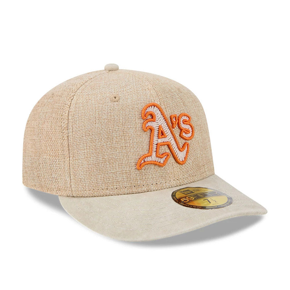 Athletics MLB Halloween Beige New Era 59FIFTY Fitted Cap, three-quarter view showing the raised orange embroidered A's logo on the beige crown, a matching beige flat visor, and a gold 59FIFTY size sticker on the visor.