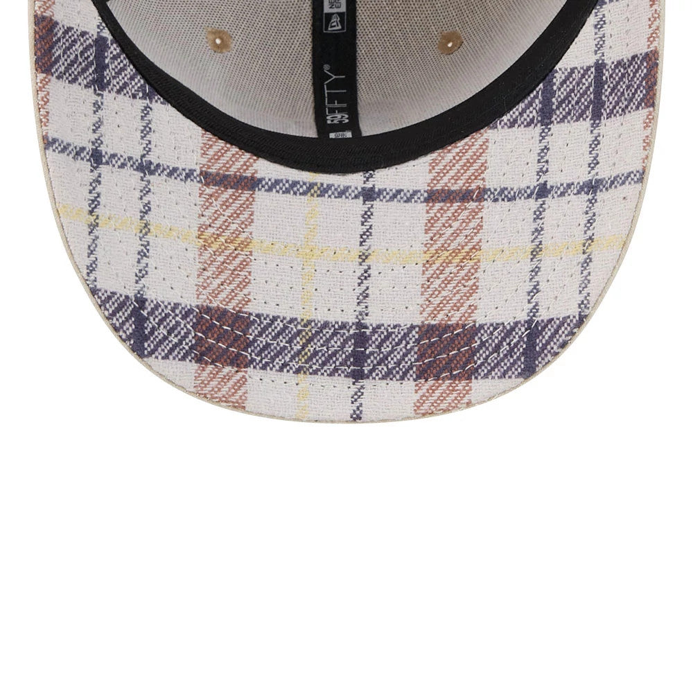 Athletics MLB Halloween Beige New Era 59FIFTY Fitted Cap, inside view showing the plaid pattern on the fabric of the visor, paired with black taping featuring 59FIFTY branding and a contrasting black sweatband lining the edge.