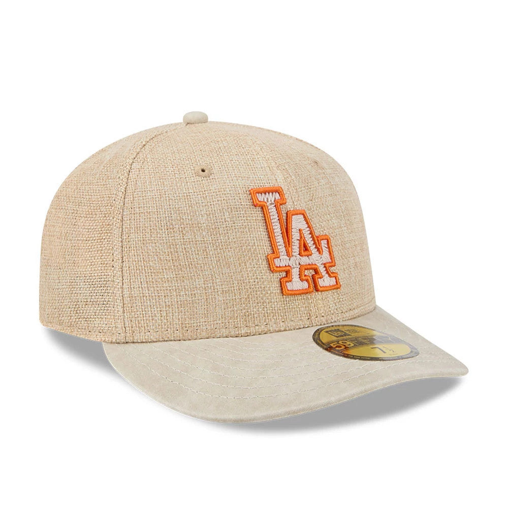 LA Dodgers MLB Halloween Beige New Era 59FIFTY Fitted Cap, three-quarter view showing the orange and white embroidered LA logo on the front panel, accompanied by a flat beige visor and a gold 59FIFTY size sticker on the visor.