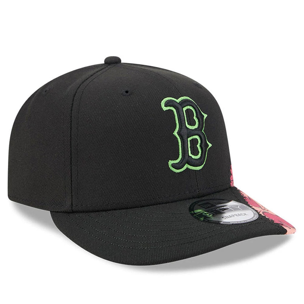 Boston Red Sox MLB Halloween Black New Era 9FIFTY Snapback Adjustable Cap, three-quarter view showing the neon green embroidered B logo on the front panel, a black flat visor with a pink floral pattern on one side, and a 9FIFTY size sticker.
