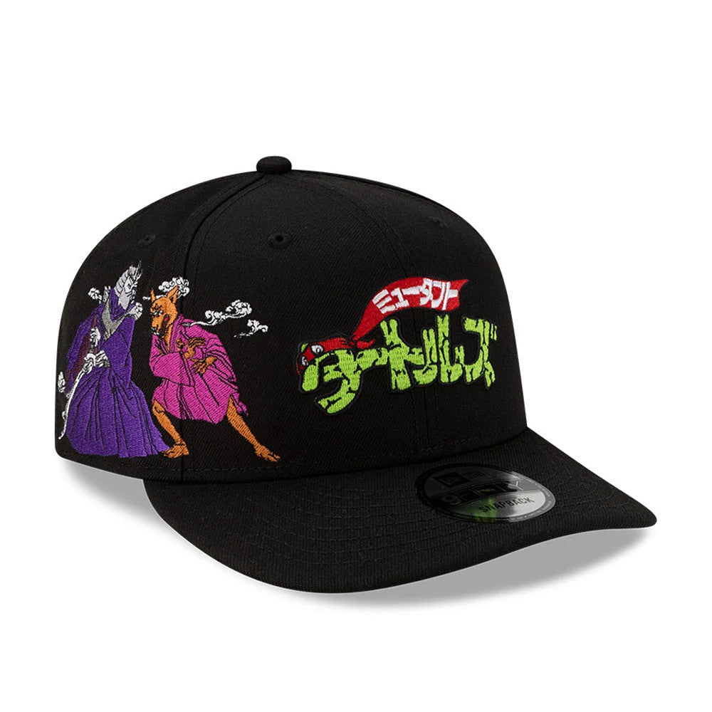 Teenage Mutant Ninja Turtles Script Black New Era 9FIFTY Snapback Adjustable Cap, front view showing embroidered Japanese script with turtle character art on the front panel, a black flat visor, and a 9FIFTY size sticker on the visor.