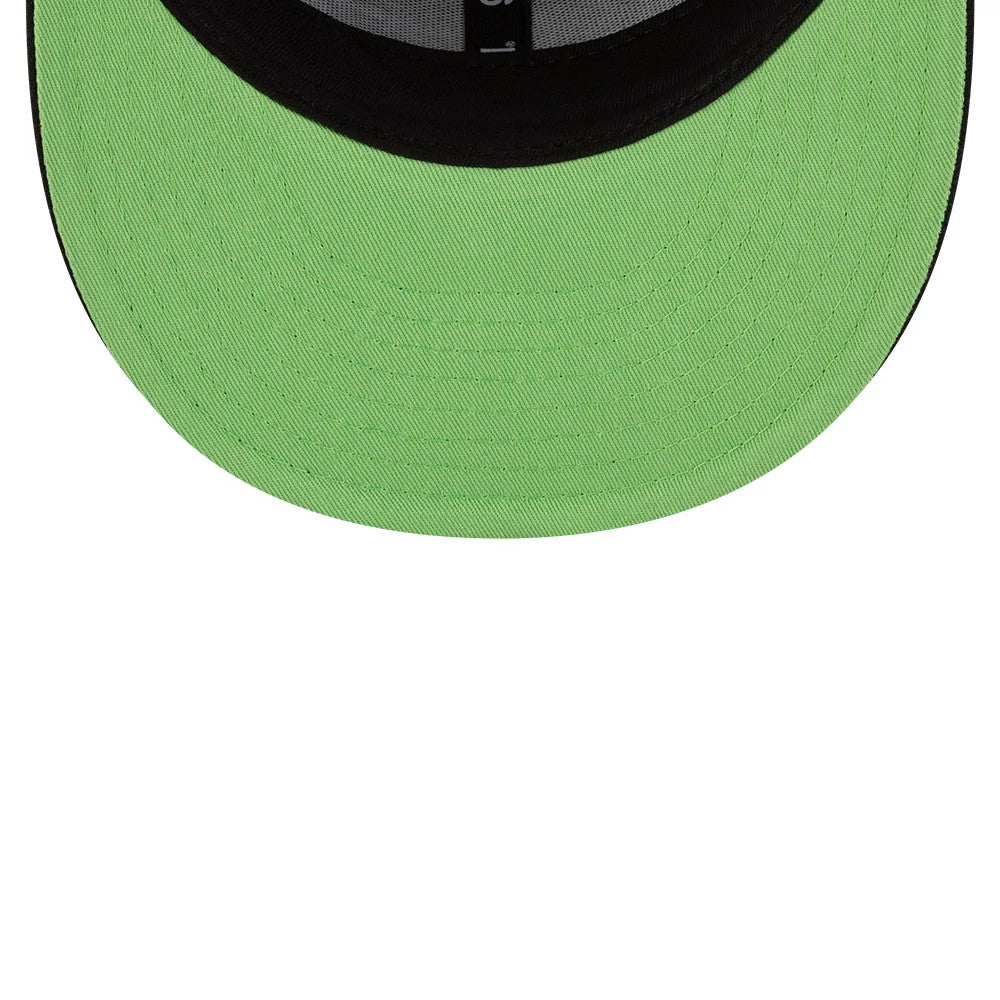 Teenage Mutant Ninja Turtles Script Black New Era 9FIFTY Snapback Adjustable Cap, inside view showing the bright green undervisor, black sweatband with white stitching, and a central label on the interior crown seams.