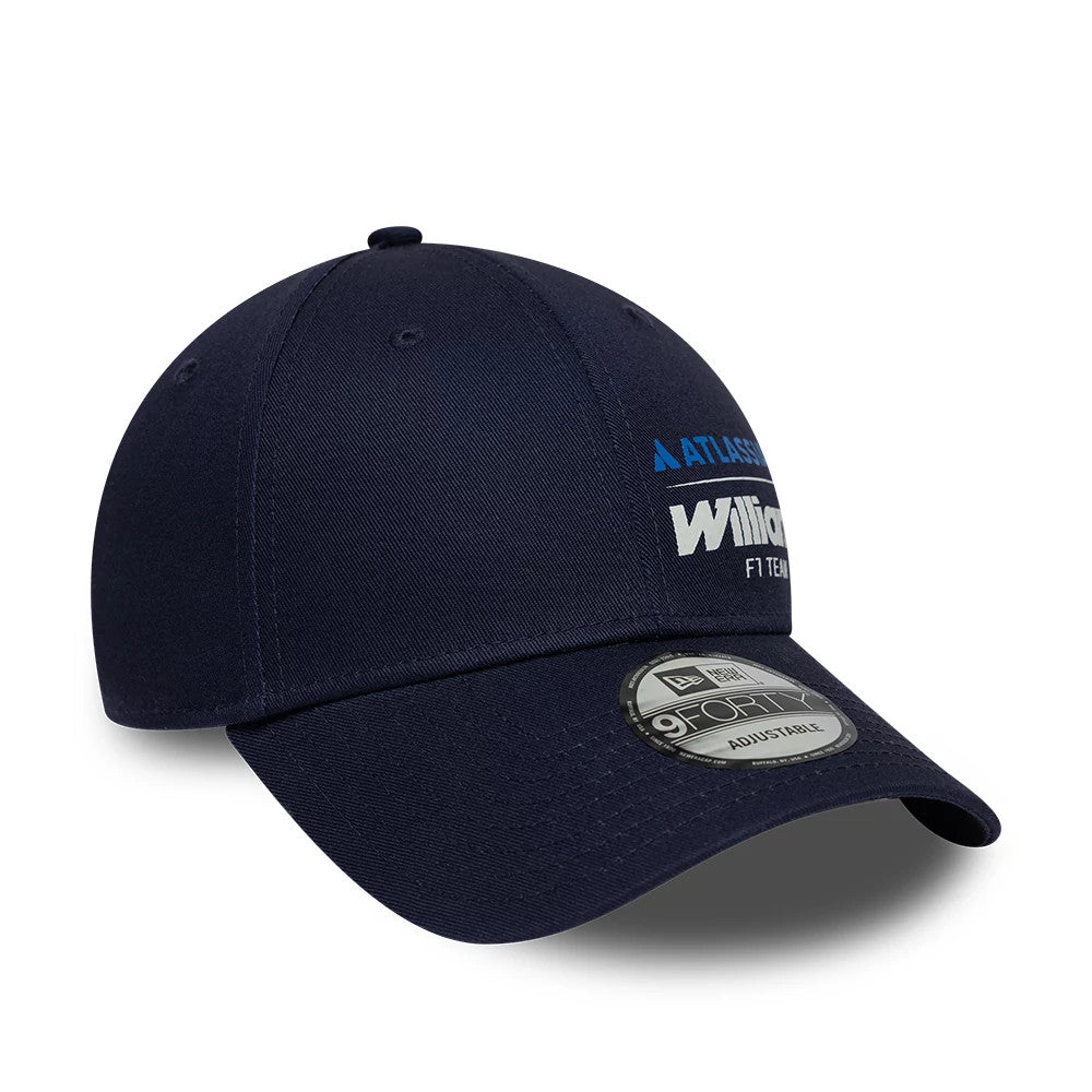 Williams Essential Navy New Era 9FORTY Adjustable Cap, three-quarter view showing the white 'Williams F1 Team' embroidered logo on the front panel, complemented by a curved navy visor and a 9FORTY size sticker on the top.