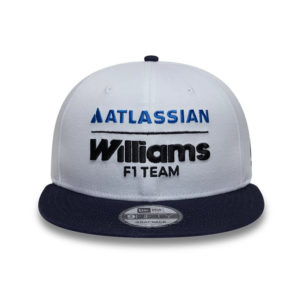 Williams Essential White New Era 9FIFTY Snapback Adjustable Cap, front view showing blue embroidered Atlassian lettering above the black Williams F1 Team logo, with a contrasting dark navy flat visor and a 9FIFTY size sticker.