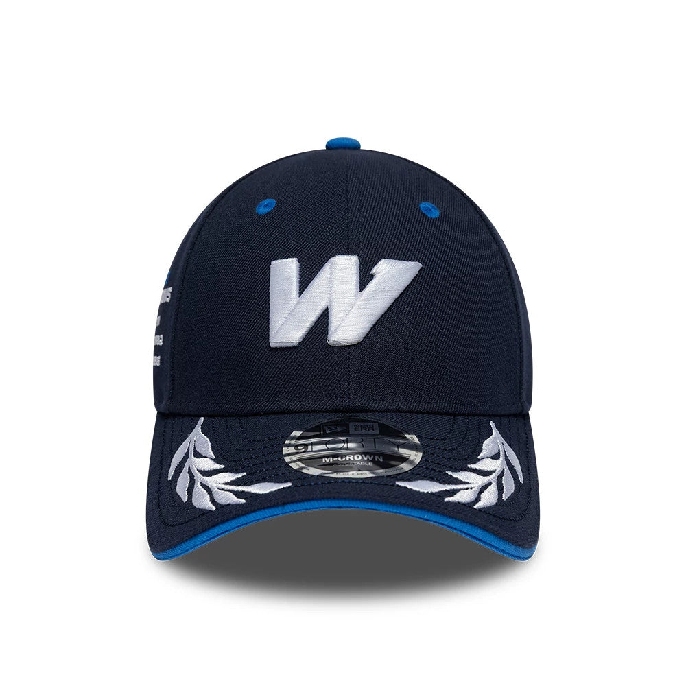 Williams Launch Navy New Era 9FORTY M-Crown Adjustable Cap, front view showing a large white embroidered W on the structured navy crown, decorative white leaf embroidery on the navy visor, and a 9FORTY size sticker on the curved visor.