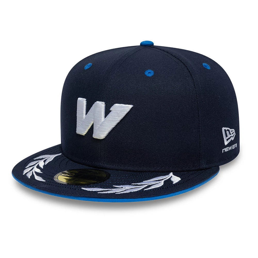Williams Launch Navy New Era 59FIFTY Fitted Cap, front view showing a raised white W logo embroidered on the front panel, an embroidered laurel design on the flat navy visor, and a gold 59FIFTY size sticker on top.