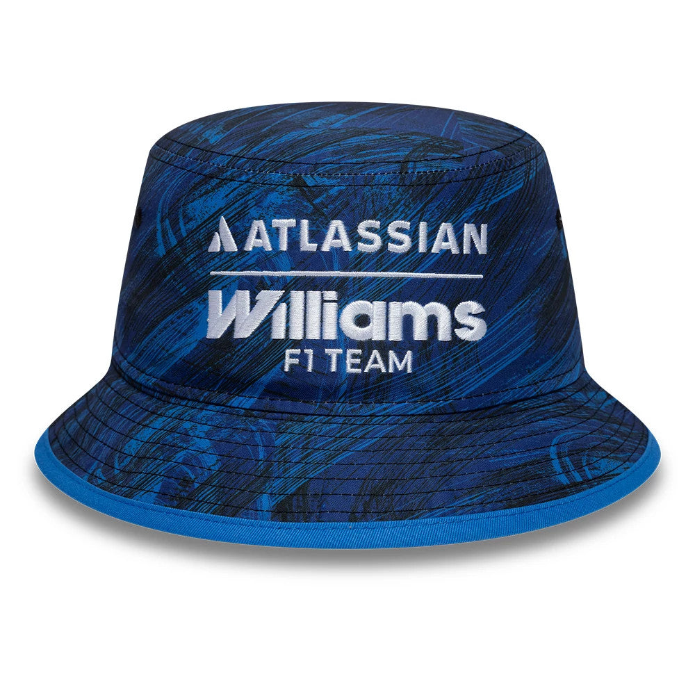 New Era Williams Team Navy Bucket Hat, front view showing the white embroidered Atlassian and Williams F1 Team logos across the structured navy crown, featuring a blue graphic pattern, with the visor edged in lighter blue.