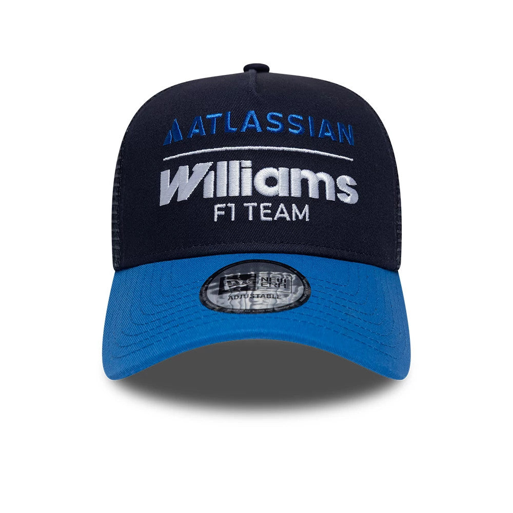 Williams Essential Navy New Era 9FORTY A-Frame Trucker Adjustable Cap, front view showing the blue embroidered Atlassian logo and white Williams F1 Team lettering on the structured navy crown, with a blue curved visor and 9FORTY size sticker.