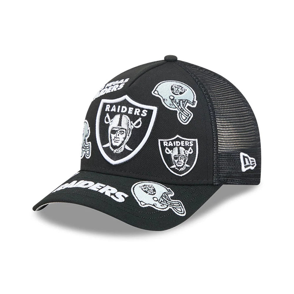 Raiders NFL All Over Black New Era 9FORTY M-Crown A-Frame Trucker Adjustable Cap, three-quarter view showing multiple embroidered Raiders logos across the black structured front panels, a curved visor with white Raiders text.