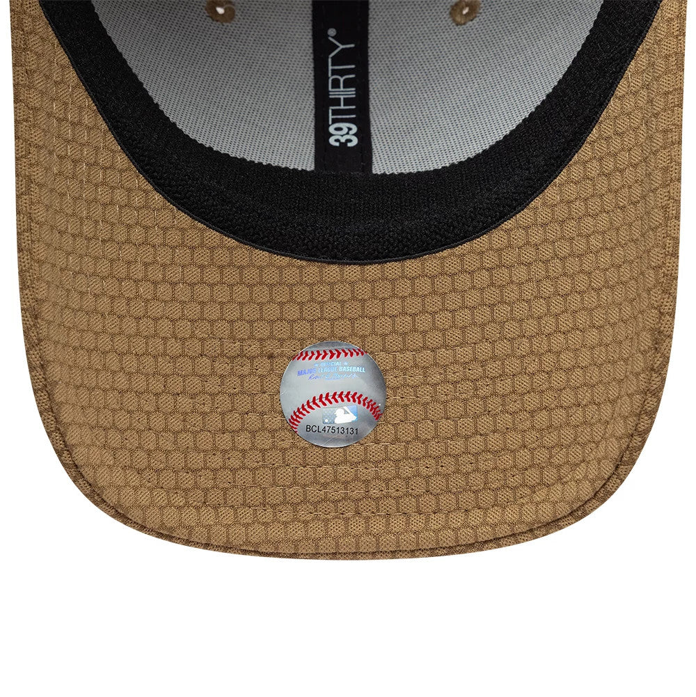LA Dodgers MLB Tech Dark Beige New Era 39THIRTY Stretch Fit Cap, inside view showing black sweatband, dark beige honeycomb-patterned undervisor with an MLB sticker, and the 39THIRTY taping running across the inner cap.