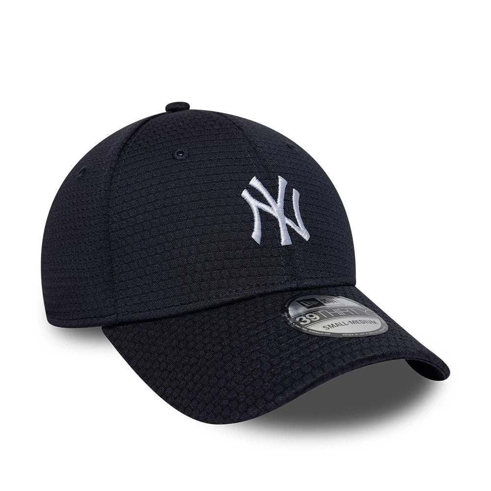New York Yankees MLB Tech Navy New Era 39THIRTY Stretch Fit Cap, three-quarter view showing the raised white embroidered NY logo on the front panel, a curved visor with a 39THIRTY size sticker, and small hexagonal textured pattern on the crown.