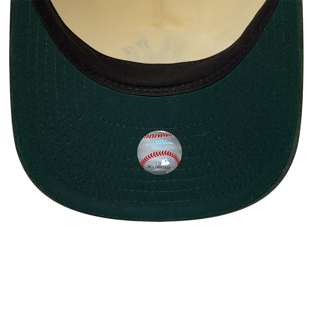 New York Yankees MLB Suede Visor Cream New Era 9FIFTY A-Frame Adjustable Cap, inside view showing a forest green undervisor with a Major League Baseball sticker at the centre, and black taping surrounding the cream sweatband.