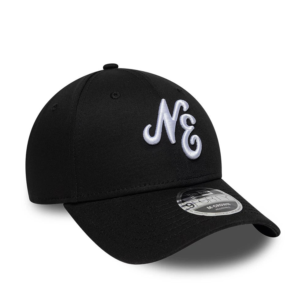 New Era Heritage Connect Black 9FORTY M-Crown Adjustable Cap, front view showing raised white NE embroidery on the structured black crown, with a curved black visor and a 9FORTY size sticker on the visor.